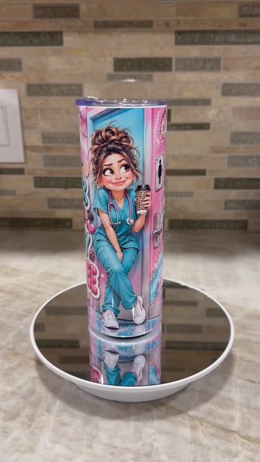 Front of pink and teal nurse tumbler showing a cartoon nurse in teal scrubs
